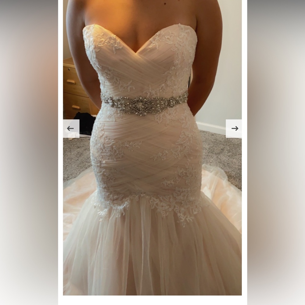 Maggie Sottero wedding dress. It is a size 8 and blush in color.